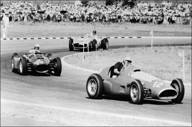Fangio, pictured in second place, races the original Silver Arrow at the Buenos Aires track in 1955. The Argentine didn't disappoint his home crowd, later taking the title.