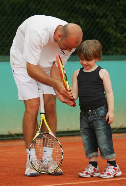 Ljubicic -- seen here giving tips to Rocco, the son of his coach Riccardo Piatti, at the 2008 French Open -- also has a daughter Zara, who was born in November 2011. 
