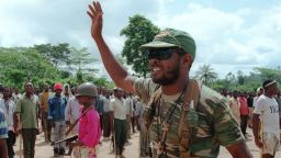 Charles Taylor, leader of the rebel National Patriotic Front of Liberia (NPFL) waves to recruits 28 May 1990 upon seizing the port of Buchanan, 200 kms (120 miles) from the capital Monrovia.