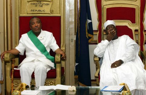 Charles Taylor, left, sits beside Liberia's new President Moses Zeh Blah during a swearing-in ceremony in Monrovia in August 2003.