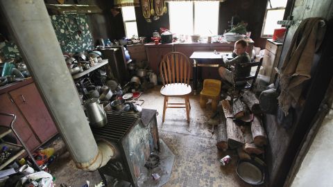 A boy sits in his uncle's home April 21 in Owsley County, Kentucky, where 44.5% of residents live below the poverty line. 