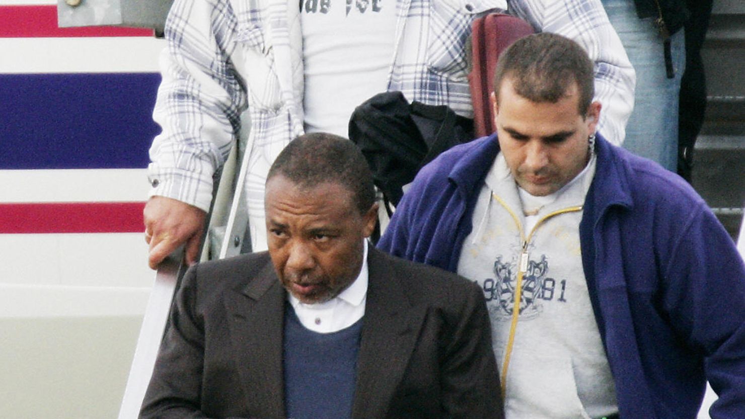 Charles Taylor arrives at Rotterdam Airport in June 2006 for his war crimes trial following his arrest in Nigeria.