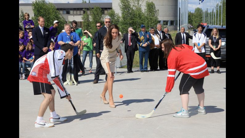 Catherine kicks off a street hockey game during an official welcome ceremony July 5 in Yellowknife, Canada.