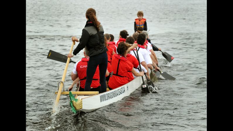 Catherine steers a dragon boat before a race against her husband on Dalvay Lake.