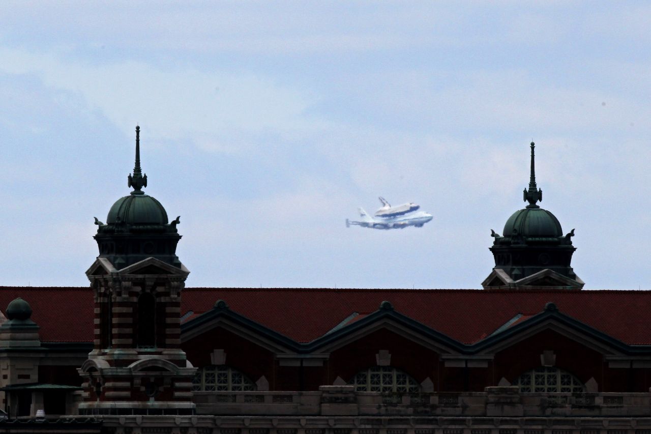 The Enterprise and 747 are seen behind Ellis Island on the shuttle's final flight Friday.