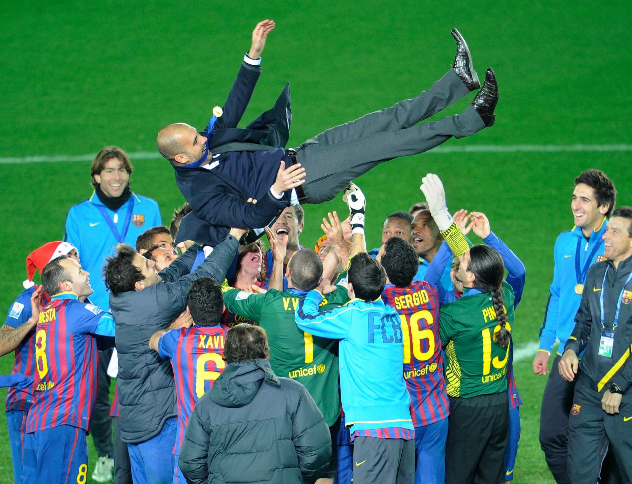 He was massively popular at the Camp Nou after four trophy-laden seasons. Here he is thrown in the air by his players after winning the FIFA Club World Cup for the second time in December 2011, having been the first team from Spain to win it two years earlier.