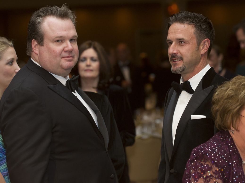 Actors Eric Stonestreet, left, and David Arquette dressed in tuxes during the dinner.