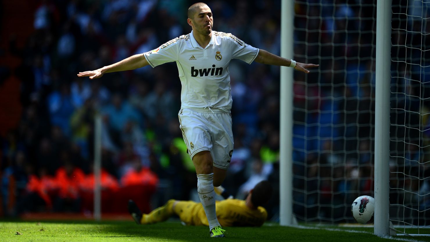 French international Karim Benzema celebrates scoring Real Madrid's second goal in a 3-0 win against Sevilla on Saturday 