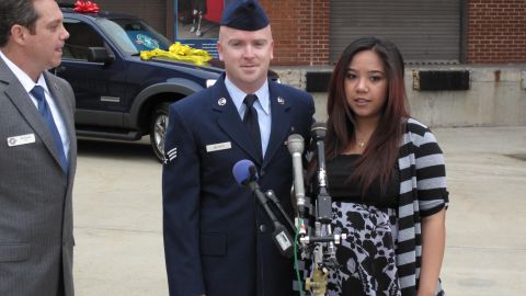 Operation Homefront President Jim Knotts presents the keys Monday to Aaron and Mercy Becker.