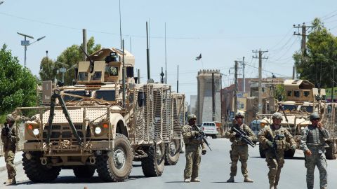 U.S. soldiers stop traffic on the road to the governor's compound in Kandahar, scene of a deadly battle on April 28.