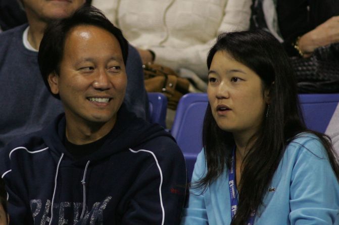Michael Chang with his wife of four years Amber Liu, herself a former Stanford University and collegiate tennis star.  They have a young daughter.
