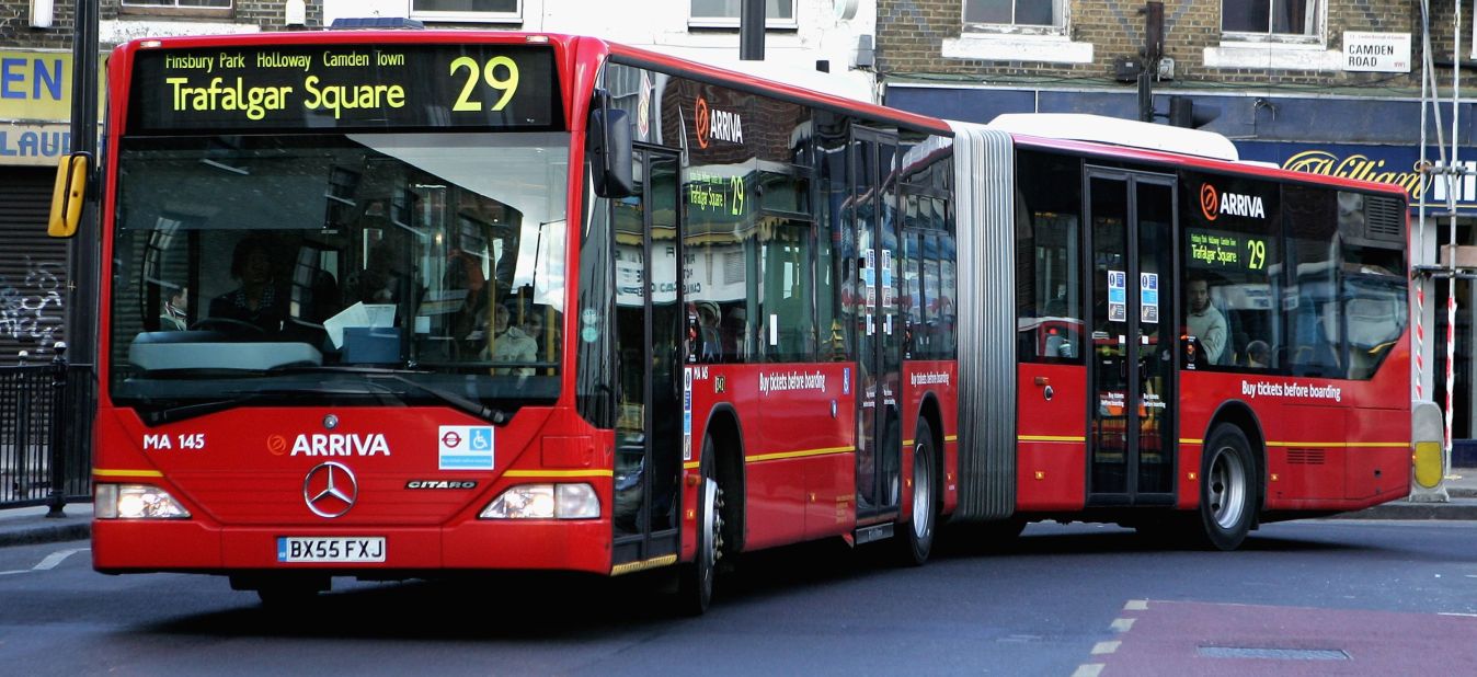 A "bendy bus" travels a route in North London in 2006.  Livingstone introduced  the "bendy buses," snake-like Mercedes vehicles that terrified road-users in London's narrow streets. He also upgraded underground trains and brought in a congestion tax on motorists entering central London.