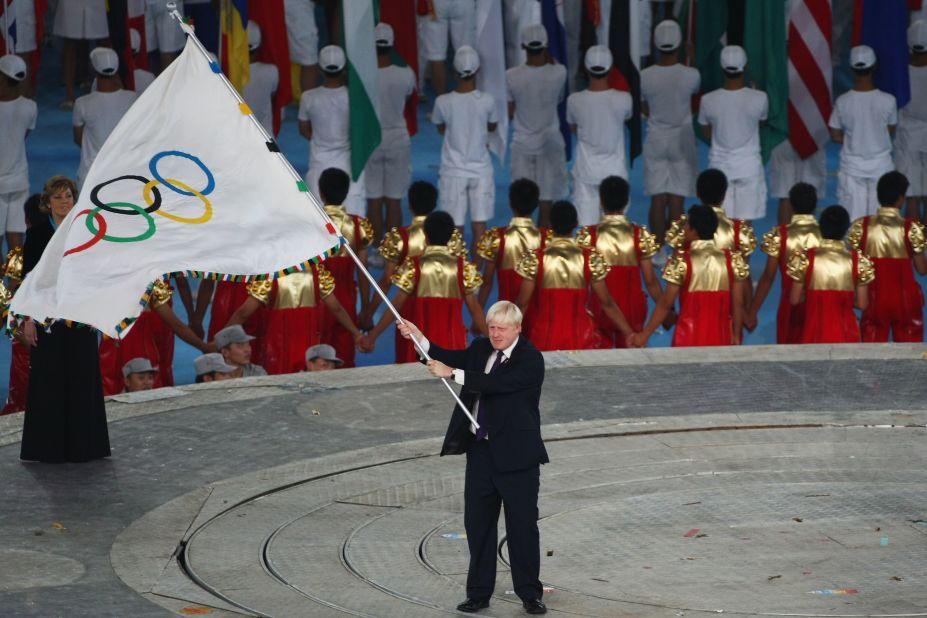 Boris Johnson waves the Olympic flag during the closing ceremony for the Beijing 2008 Olympic Games.  In 2005, then-Mayor Ken Livingstone was instrumental in helping to win the 2012 Summer Olympics for London, and both candidates have claimed credit for the regeneration of East London near the Olympic site.
