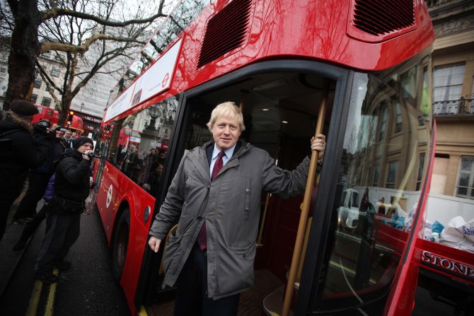 London Mayor Boris Johnson travels on a new prototype  double-decker bus near Trafalgar Square in December 2011. Among Johnson's pledges was to scrap the "bendy buses" and replace them with British-built Routemasters, which appeared on the streets this year.