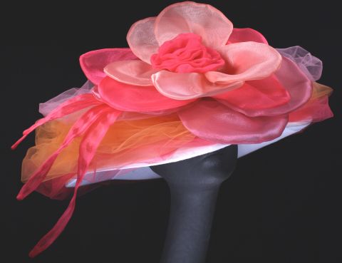 This "Candy" creation by Steinmann showcases the bright pinks and flowers that Derby-goers love, like the fabric peony that dominates this wide brim design.