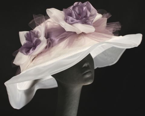 The ruffled edges of Steinmann's "Jamie" hat have long been a tradition at the Derby, as well as the braiding and bows that adorn the top.
