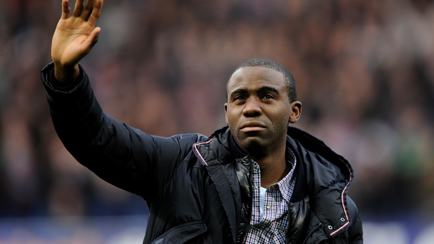 Fabrice Muamba waves to the crowd during his emotional appearance at the Reebok before Bolton's game against Tottenham.