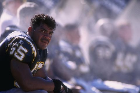 Seau sits on the Chargers' bench in a 1996 game.