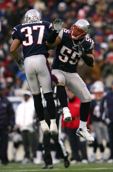 Patriots Rodney Harrison and Seau celebrate a defensive stop against the Chargers during the 2008 AFC Championship Game.