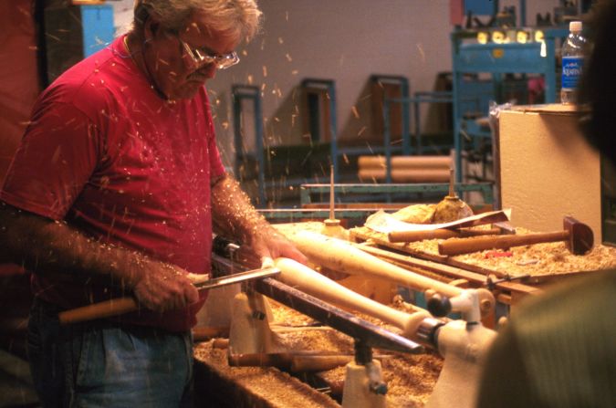 Workers used to turn all the bats by hand, and they're still trained to handcraft them for demonstrations.