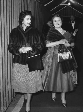 A relaxed evening at the theater: The Queen Mother and Queen Elizabeth II arrive at Windsor's Theatre Royal for a performance of George Bernard Shaw's "You Never Can Tell" on February 23, 1962.