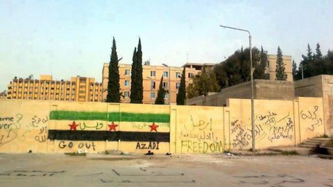 Anti-regime graffiti sprayed on the walls of Aleppo University is shown in this photo from Monday.