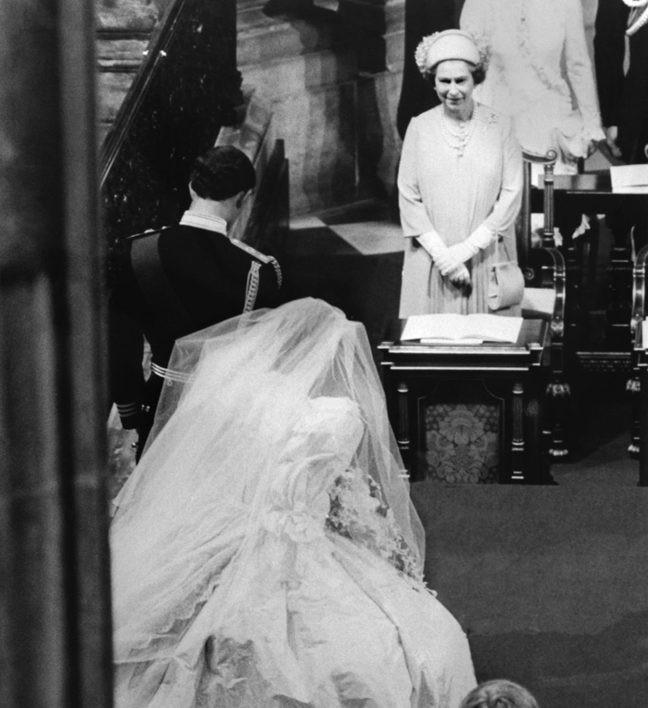 The queen's eldest child, Charles, Prince of Wales, bows while his new bride, Princess Diana, curtsies to the British sovereign as they leave St Paul's Cathedral, on July 29, 1981.