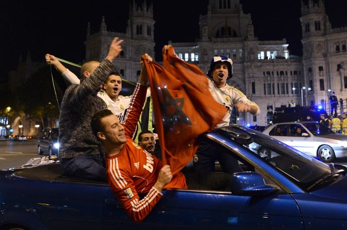 Real Madrid supporters celebrate their team's triumph, which was clinched with two games to play after a 3-0 win at Athletic Bilbao. 