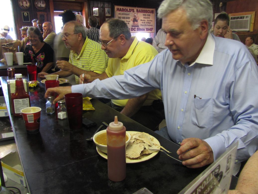 Patrons line the counter, hungry for a last taste of stew and cornbread