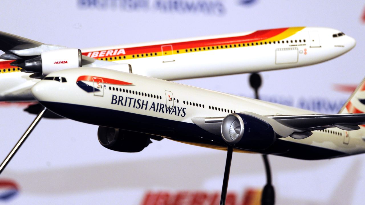 Model British Airways and Iberia aircraft displayed at a press conference in Madrid in 2010, held to discuss the successful merger between the airlines. Industry analysts are tipping that further mergers are on the way.