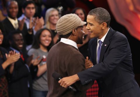 Before a youth-oriented town hall, Obama greets moderator Sway Calloway in Washington on October 14, 2010. The event was broadcast on MTV, BET and CMT.