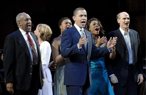 President Obama leads a birthday salute to Sen. Ted Kennedy in Washington on March 8, 2009. He was joined onstage by performers such as comedian Bill Cosby, left, and singer-songwriter James Taylor, right. Kennedy's birthday was February 22.