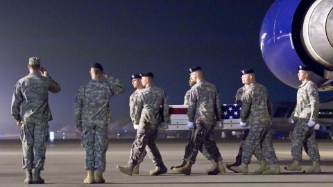 A U.S. Army carry team transfers the remains of Army Capt. Bruce K. Clark at Dover Air Force Base, Delaware, on Thursday.