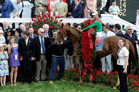 Last year's champions -- jockey John Valazquez atop  Animal Kingdom -- celebrate winning the  137th Kentucky Derby. The race is known as the "Run for the Roses," after the garland of flowers draped on the winner.