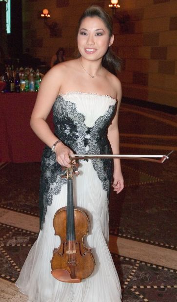 Still in her early 20s, Chang is seen here clutching her priceless 17th-century "Guarneri del Gesu" violin, given to her as a present by the late Ukrainian violinist and conductor Isaac Stern, who had a reputation for discovering new talent.