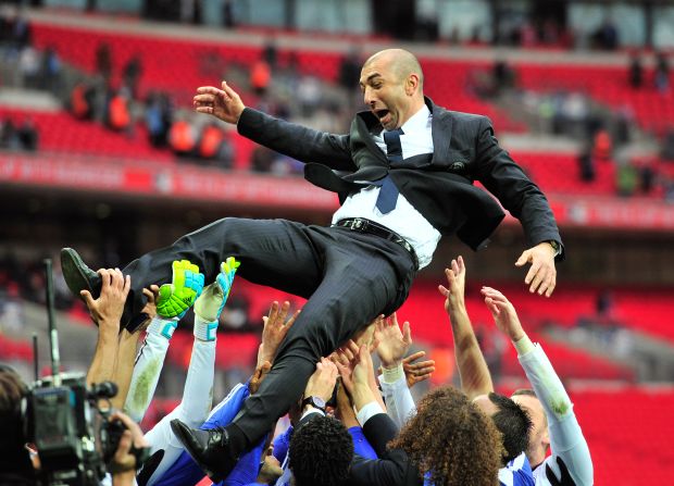 Chelsea's caretaker manager Roberto Di Matteo is thrown into the air in celebration by his players after their 2-1 victory against Liverpool at London's Wembley Stadium.