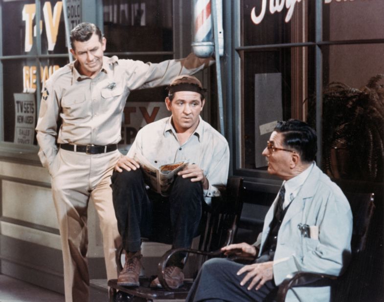 Andy Griffith, left, Lindsey, center, and Howard McNear talk outside a barber shop in a still from "The Andy Griffith Show" around 1966. 