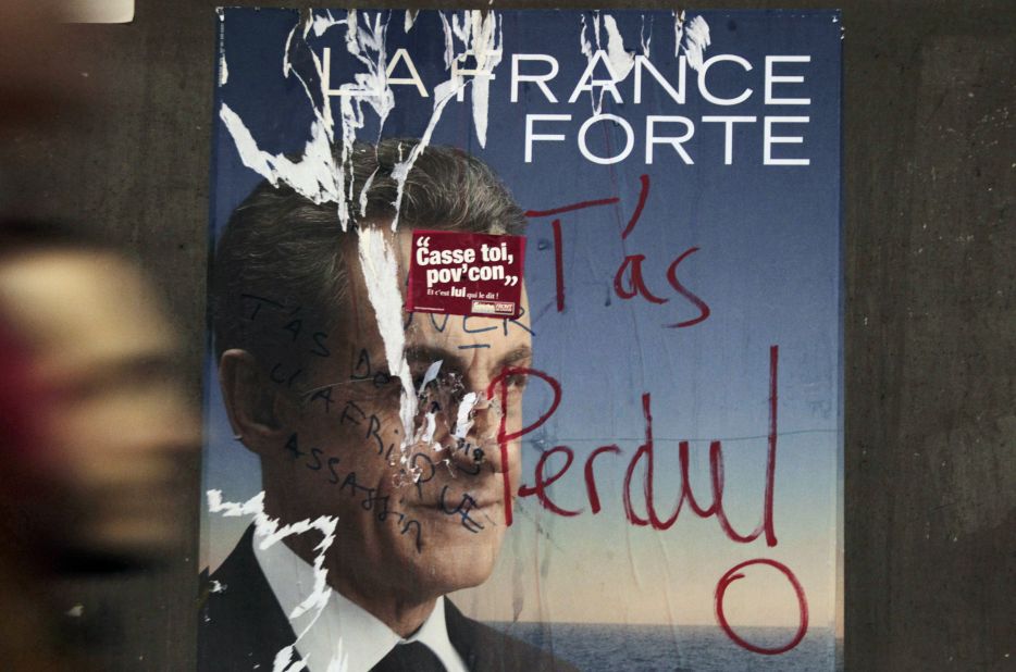 A vandalized campaign poster in Paris reads, "You've lost!" Defeating incumbent president Nicolas Sarkozy, Hollande will be the nation's first left-wing president since 1995.