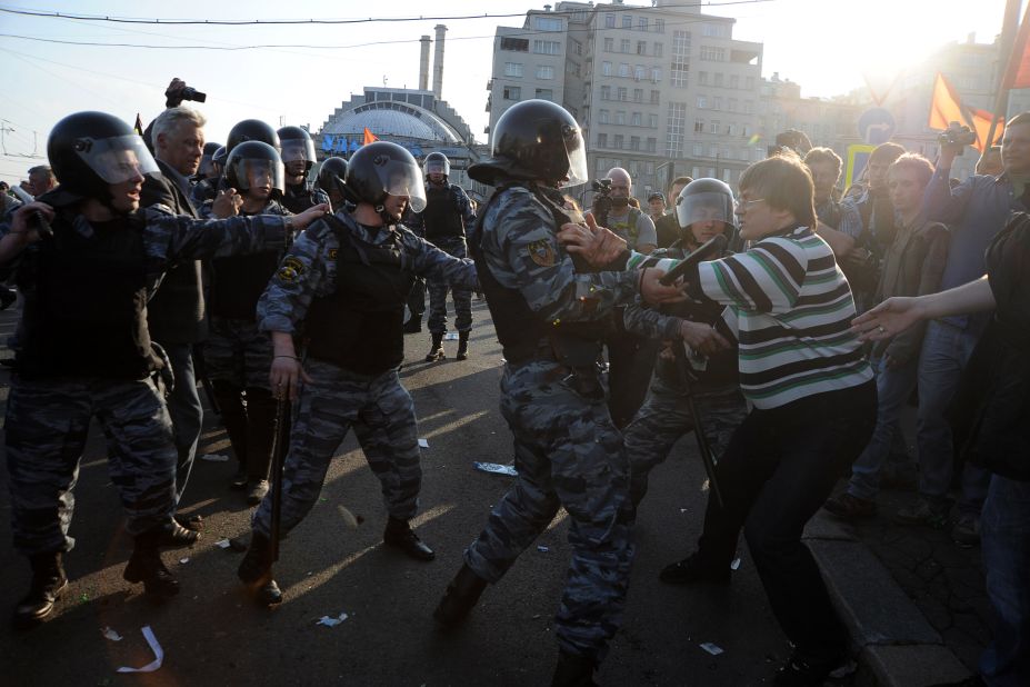 Opposition supporters clash with riot police during the "March of Millions" protest on Sunday.