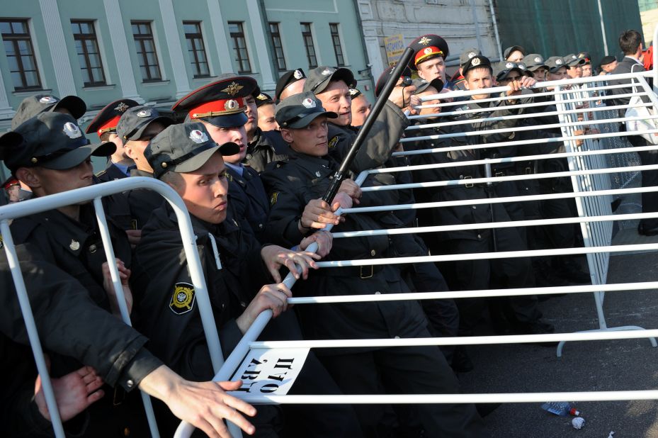 Russian police officers attempt to block off a street during the rally in Moscow.