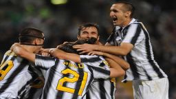 Players of Juventus FC celebrate after beating Cagliari 2-0 to win the Serie A Championships Sunday in Trieste, Italy. 