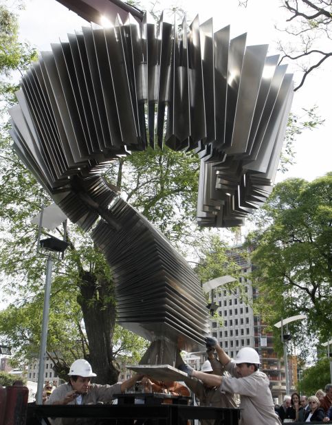 A shot from 2007 shows workers installing the first monument in the world dedicated to tango. The two ton and five-meter-tall metallic structure represents a bandoneon (type of concertina), a typical instrument used in tango.