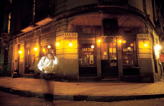 A young tango dancer performs outside an old world café in the bohemian district of San Telmo, Buenos Aires. It's not uncommon stumble across many a "tanguero" busking for change across the capital city. 