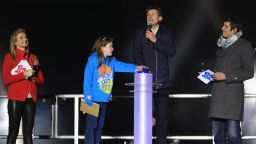 Nine-year-old schoolgirl Niamh Clarke-Willis makes history as she presses the button to officially open the Olympic stadium along with London 2012 chairman Sebastian Coe. They were joined on stage by TV presenters Gabby Logan and Vernon Kay. 
