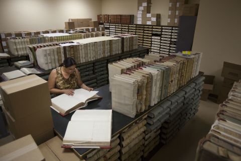 Sosa, Tombstone's archivist, searches for documents at the Cochise County Recorder's Office in Bisbee, Arizona. She is looking for evidence supporting Tombstone's water rights case against the U.S. Forest Service.