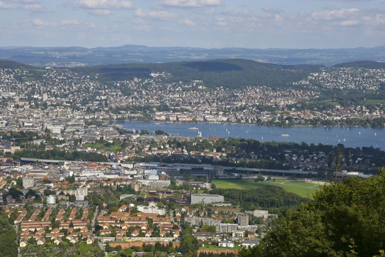 Zurich stretches out between two tree-covered chains of hills.