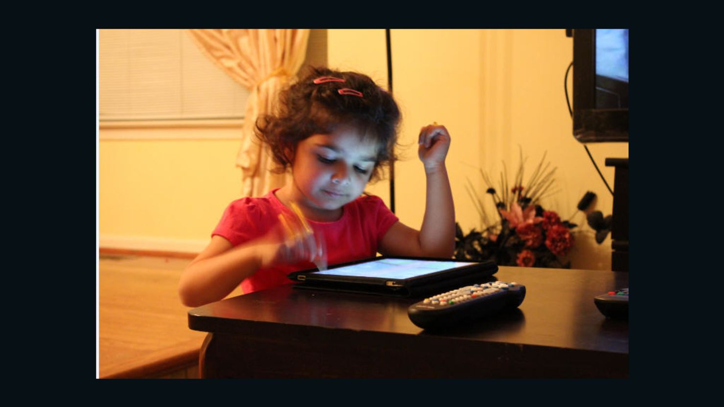 Sharia Siddiqui uses an iPad to help her communicate. Her father says it's "given her a sense of control she never had."