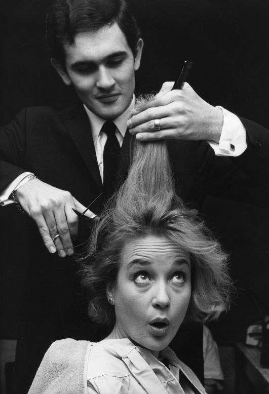 English actress Sylvia Syms having her hair cut in preparation for her role as Peter Pan in London's Scala Theatre pantomime. Her hair is being cut by Roger, the short hair cut expert at Vidal Sassoon's London salon in 1965.