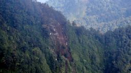 Debris of plane crash from a Russian Sukhoi Superjet 100 is seen on the slope of Salak Mountain Western Java province.
