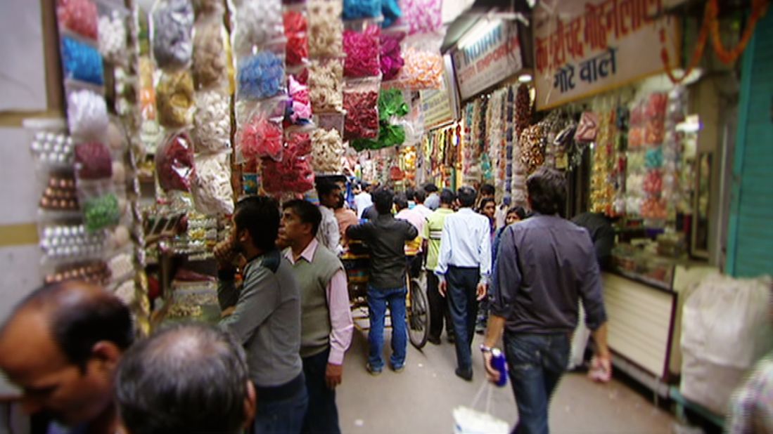 Cooper described the crowded shopping district as "exciting and chaotic and noisy and dusty and smoky and hot." This, however, was small price to pay for the astonishing array of fabrics and accessories pouring from every street-side stall and shop. 